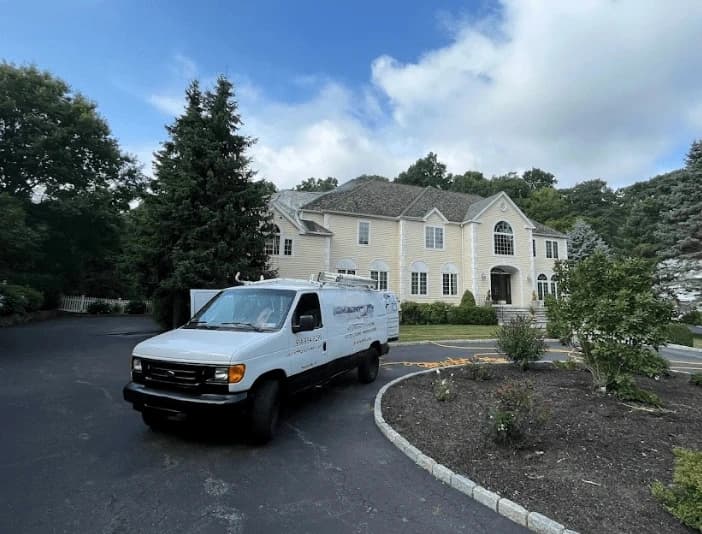 Warrensville Heights Power Washing technician performing thorough gutter cleaning service in Warrensville Heights