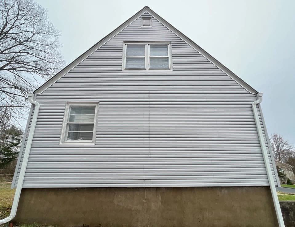 Warrensville Heights Power Washing technician performing detailed house washing in Warrensville Heights residential area